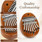 Brown wooden kalimba with silver metal keys and smooth rounded edges