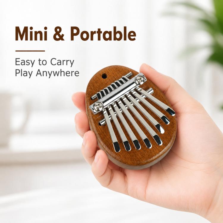 Brown mini kalimba thumb piano held in hand with silver metal keys
