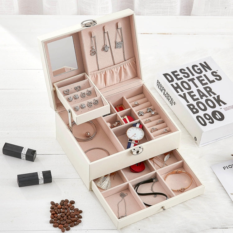 White jewelry organizer box open with trays for rings, necklaces, and earrings