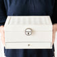 White jewelry storage box with quilted top insert and front lock clasp
