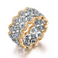 Gold and silver pavé diamond wedding ring with interwoven geometric band