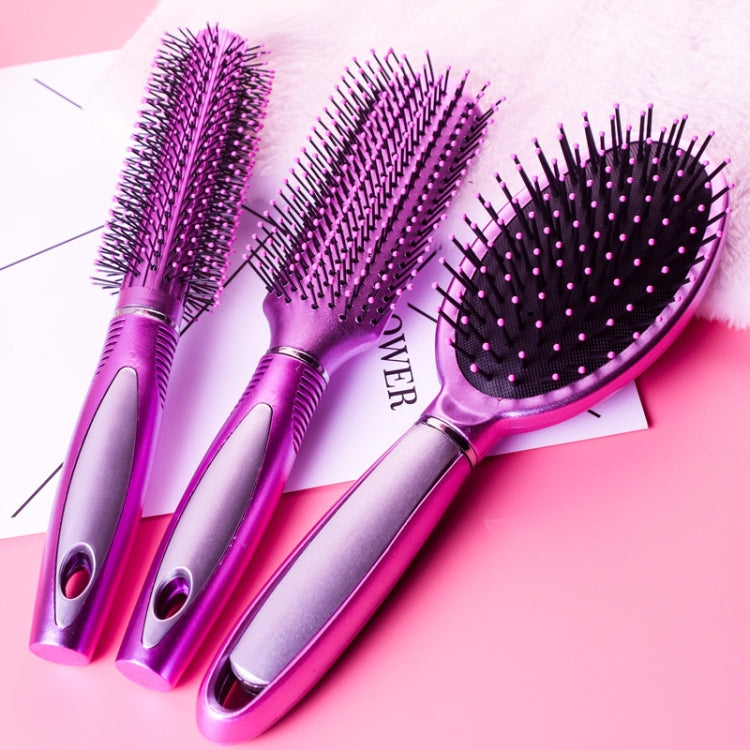 Three purple hair brushes with black bristles and silver handles, air-cushion style.