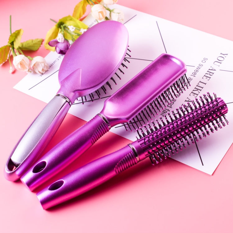 Purple air-cushion hair brushes with black bristles, silver grips, and vented back.