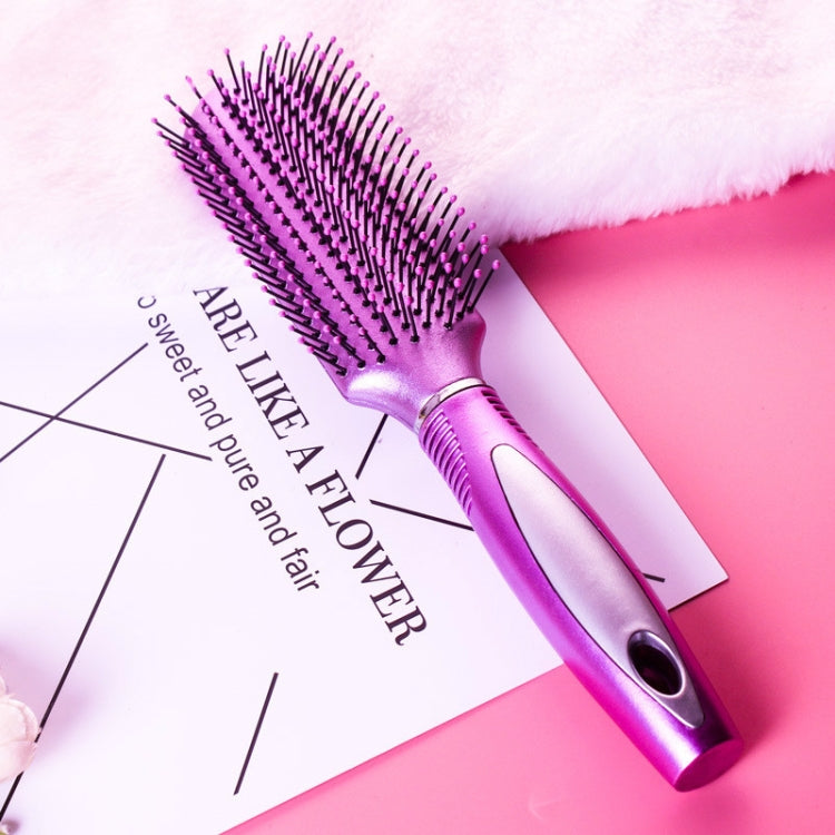 Purple oval air-cushion hair brush with black bristles and silver grip for styling.