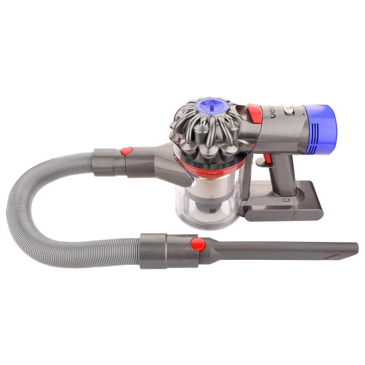 Crevice tool pair on vacuum: gray nozzles with red buttons and transparent bin
