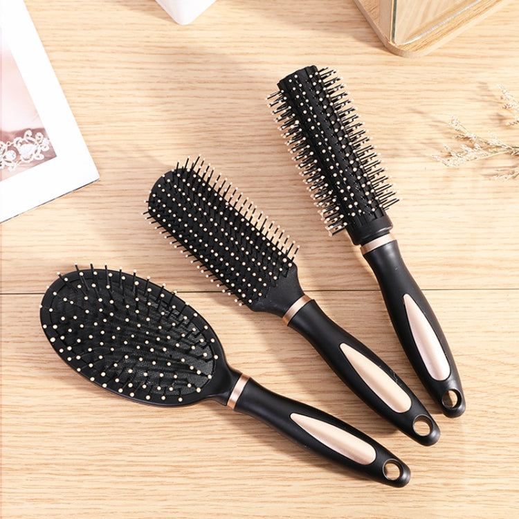 Set of three black hair massage brushes with silver pins and oval pads.