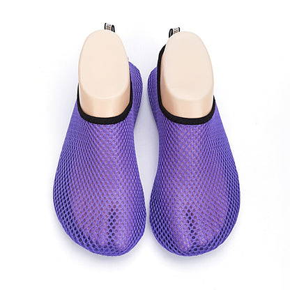 Purple mesh diving socks with beige sole and black rim, pair front view