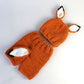Orange wool knit hat and pants with fox face patches and pointed ear tops