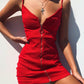 Red fitted sling dress with V-neck, lace-up front, and center front zipper