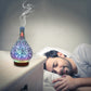 Teardrop LED aroma humidifier with blue-purple glow emitting visible mist