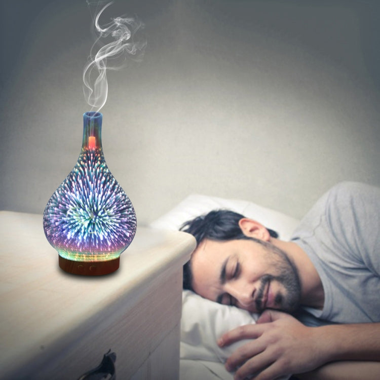 Teardrop LED aroma humidifier with blue-purple glow emitting visible mist
