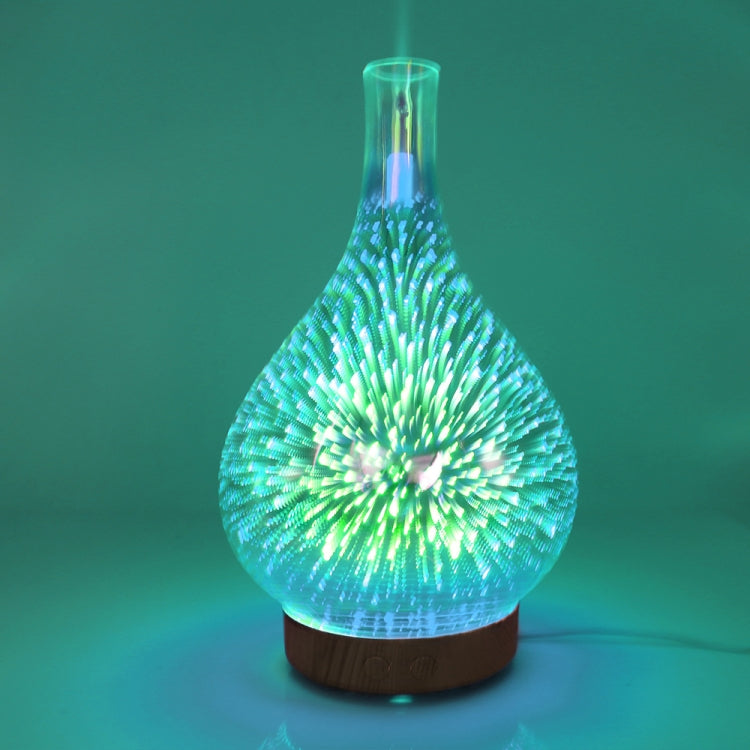 LED aroma humidifier with green 3D fireworks glow and visible mist from clear bulb