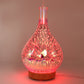 LED aroma humidifier night light with red 3D fireworks glow and visible mist