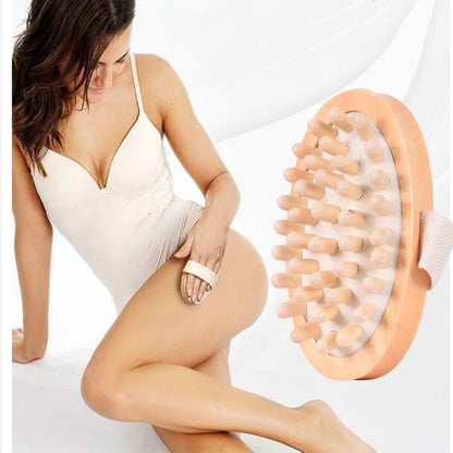 Wood massage body brush with oval head, rounded spikes, and soft fabric strap