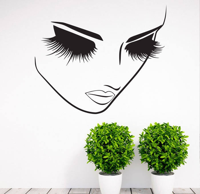 Makeup face wall decal set featuring black lashes and lips motif