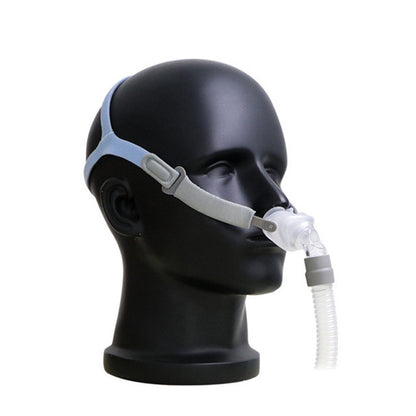 Dark nasal CPAP mask with head strap and nasal pillows, front view