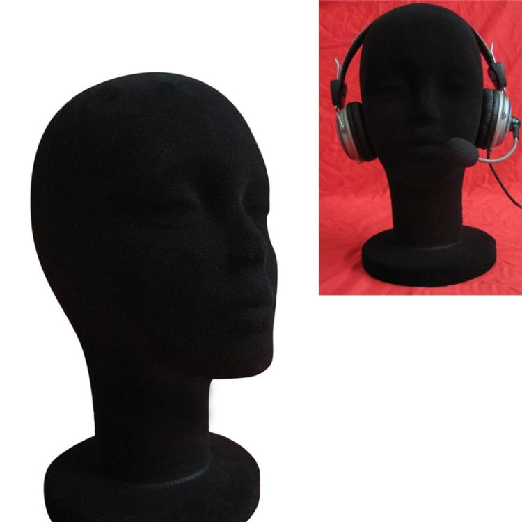 Black foam mannequin head display stand, front 3/4 with headset
