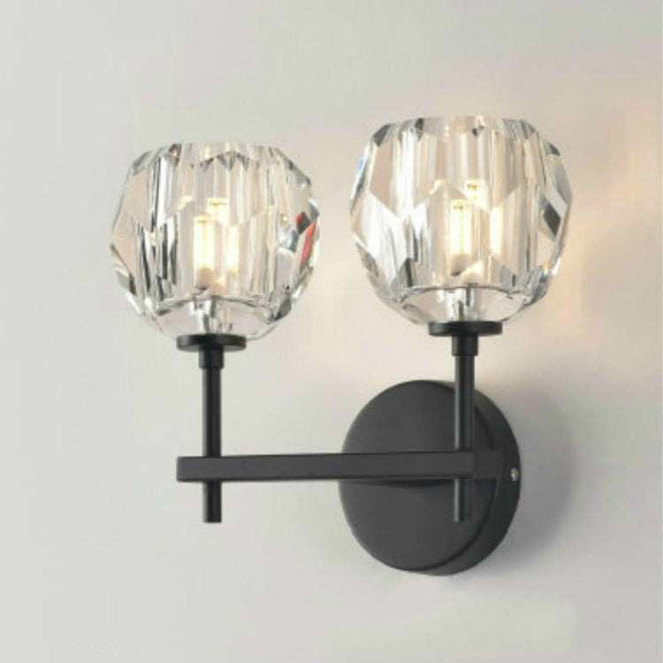 Black double wall sconce with two faceted crystal shades and round backplates