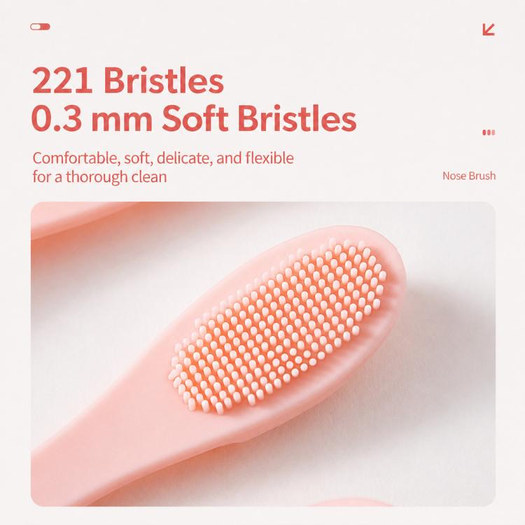 Pink silicone face brush with dense soft bristle dot head for exfoliating cleansing
