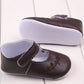 Baby girl first walker crib shoes in dark brown with hook strap and floral embroidery detail