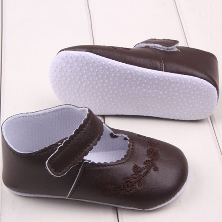 Baby girl first walker crib shoes in dark brown with hook strap and floral embroidery detail