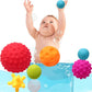 Six textured rubber bath balls in red, orange, blue, purple, yellow, green