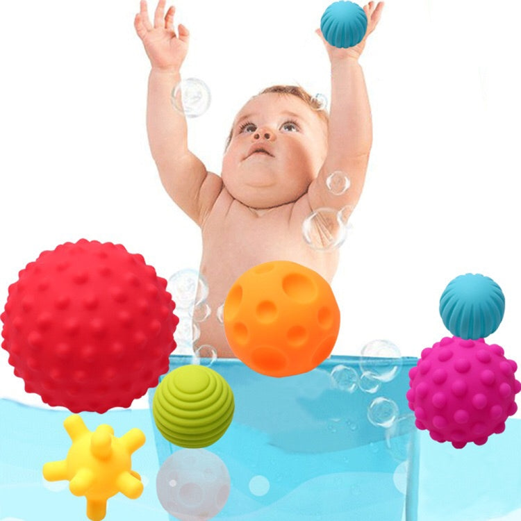Six textured rubber bath balls in red, orange, blue, purple, yellow, green