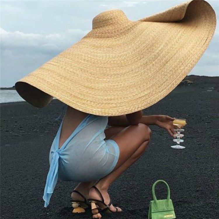 Oversized woven straw sun hat with wide floppy brim, beige