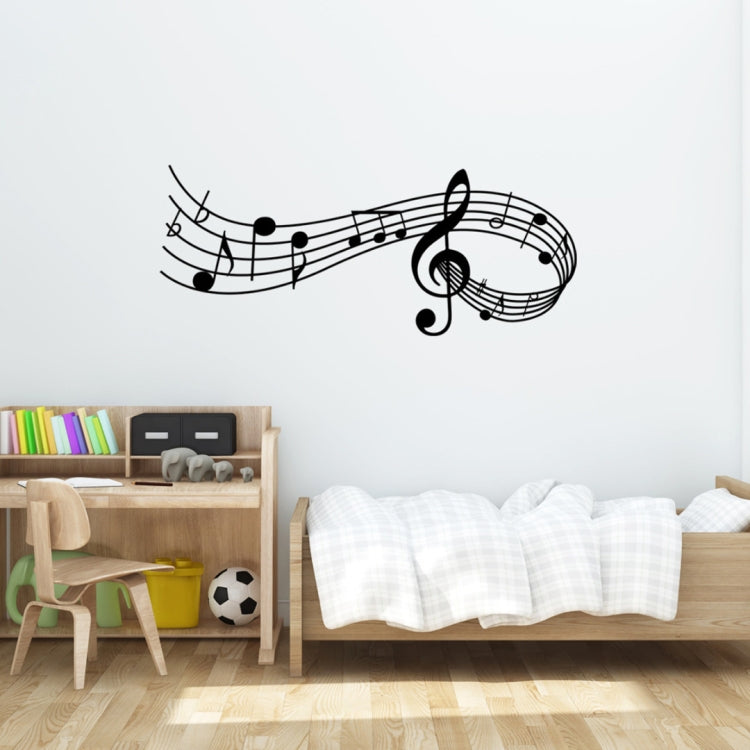 Black music note wall decal with treble clef and musical notes on a light wall