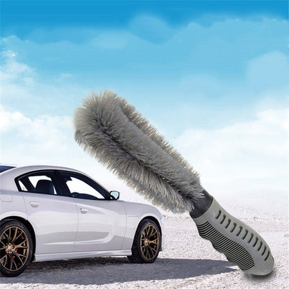 Car wheel cleaning brush with gray bristles and ribbed black handle