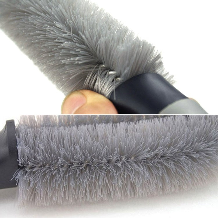 Car wheel brush head close-up with dense gray bristles and black base