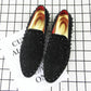 Pair of black pointed-toe rhinestone flats with red-lined interior