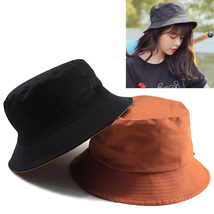 Reversible cotton fisherman hats in black and orange with wide brims