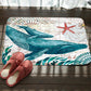 Whale and starfish printed flannel bath mat with non-slip backing, teal and cream