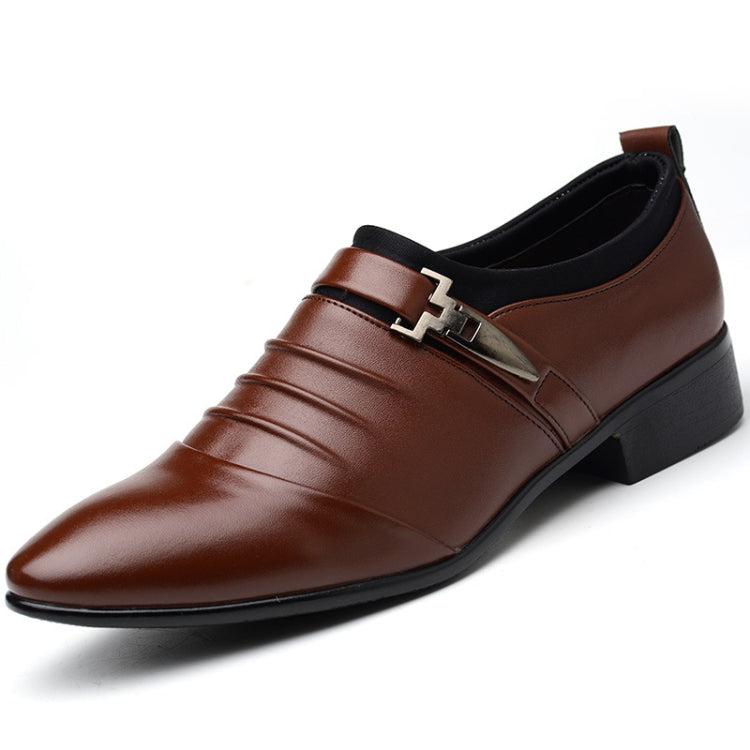 Brown slip-on oxford dress shoe with pointed toe, side buckle strap, and dark sole