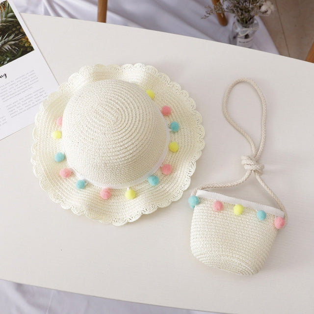 Girls straw sun hat with colorful pom-pom trim and mini satchel set, light beige