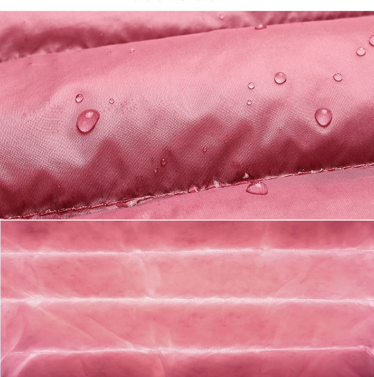 Pink water-resistant puffer fabric with droplets and stitched seam detail