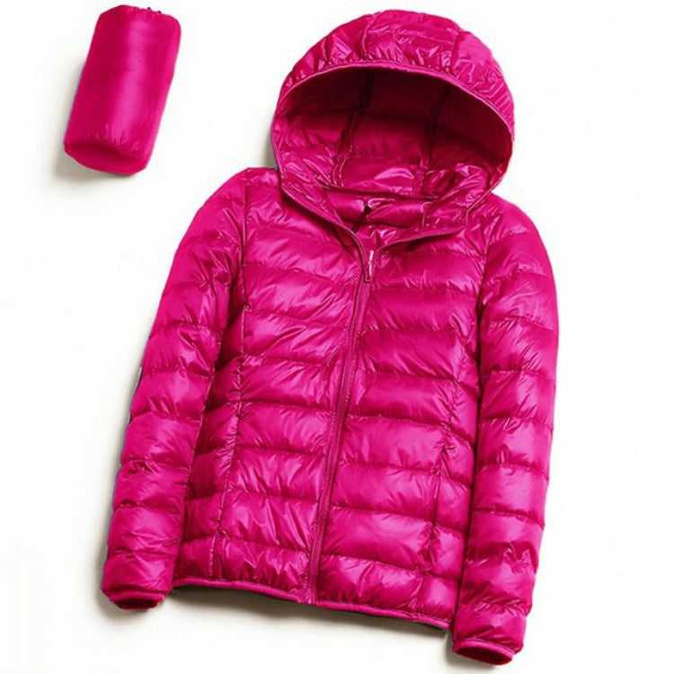Women’s hooded puffer jacket in bright pink with full-zip front and quilted insulation
