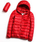 Women’s hooded puffer jacket in red with full-zip front and quilted insulation