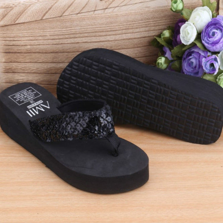 Sequin wedge flip-flop sandals with black sequin strap and black wedge platform sole