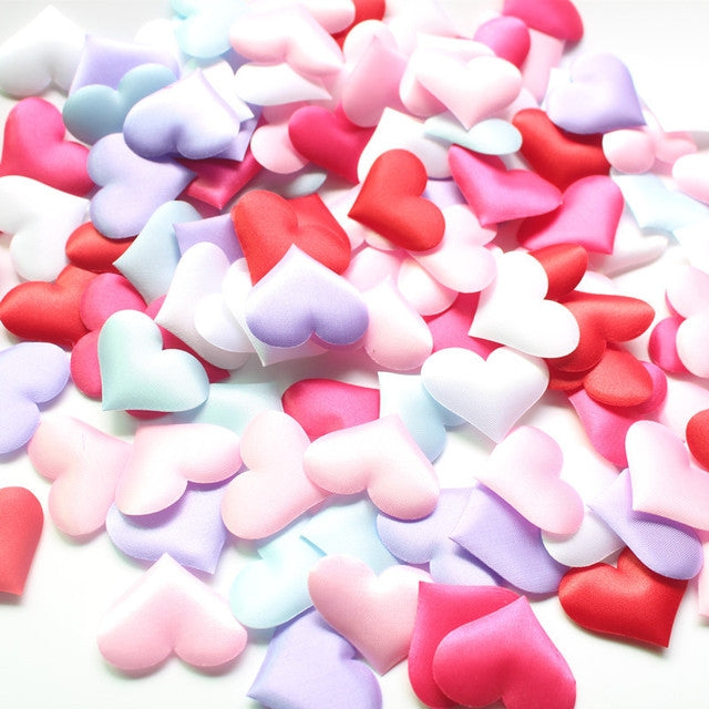 Pastel and bright heart-shaped faux petals mix with red, pink, white, and blue