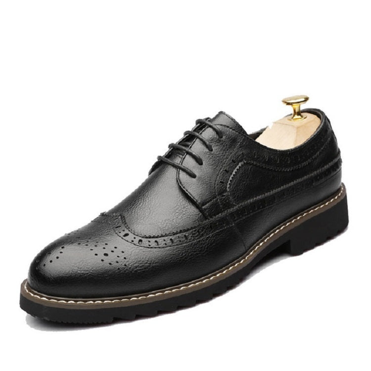 Black brogue oxford lace-up shoe with stitched detailing and low-profile rubber sole