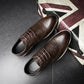 Brown lace-up brogue oxford shoes with wingtip stitching and cushioned dark outsole