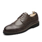 Dark brown lace-up brogue oxford shoe with wingtip perforations and rubber sole