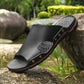 Men's black slip-on slide sandals with perforated footbed and red trim