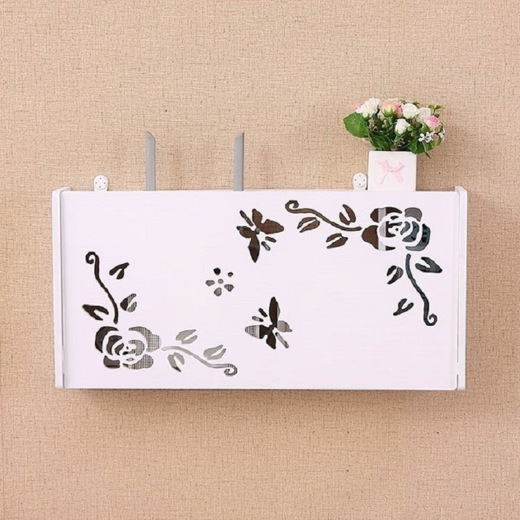 White wall-mounted router storage box with floral cutout design and two vertical vent rods