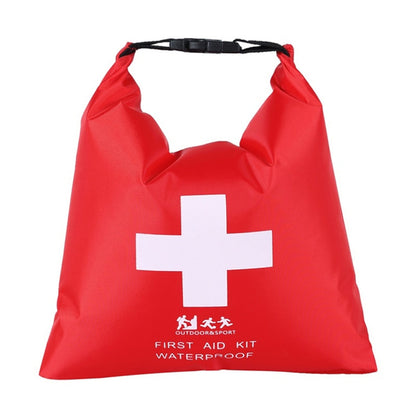 Red waterproof first aid kit dry bag with white medical cross and black carrying strap.