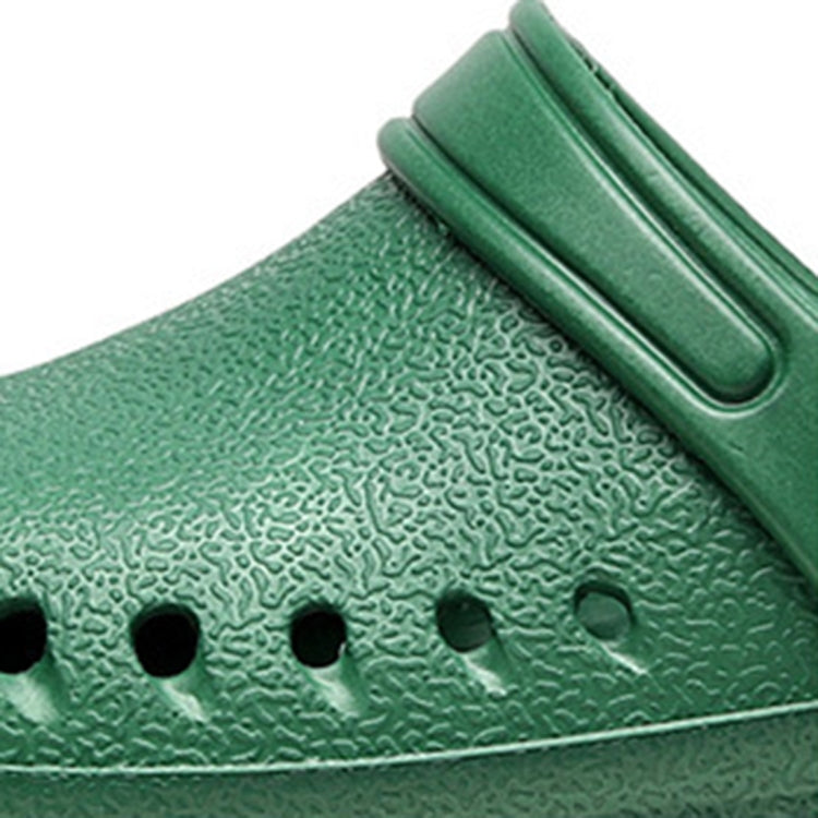Green medical clog upper close-up with textured surface and ventilation holes