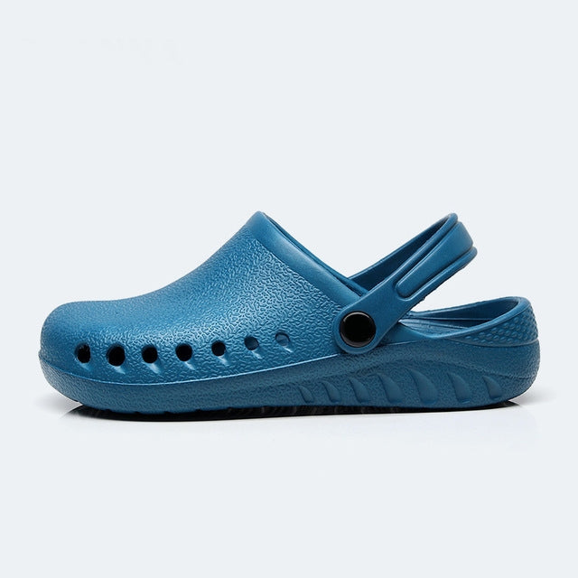 Lightweight slip-on medical clog with ventilation holes and heel strap, dark blue