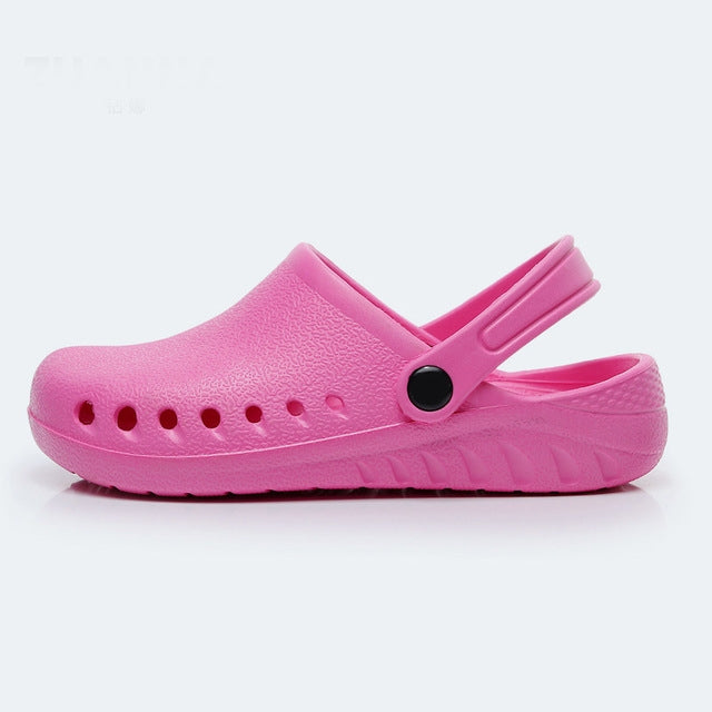 Lightweight slip-on nursing clog, pink with perforated toe and adjustable heel strap